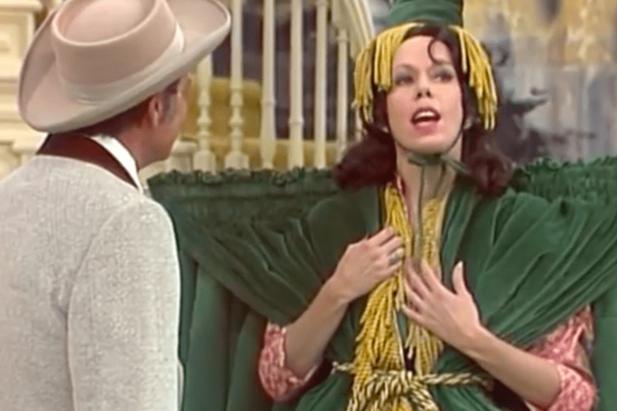 Carol Burnett wearing the green curtain dress.