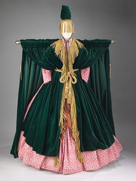 Carol Burnett's green curtain dress displayed on a mannequin.